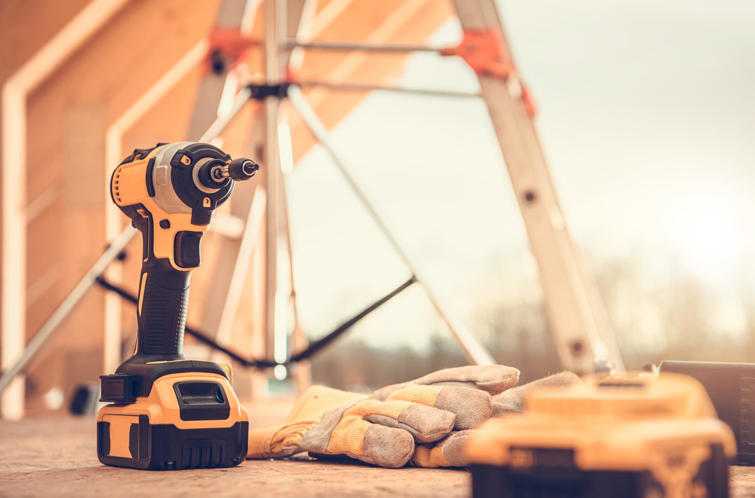 Contractors, tools, and trucks at work