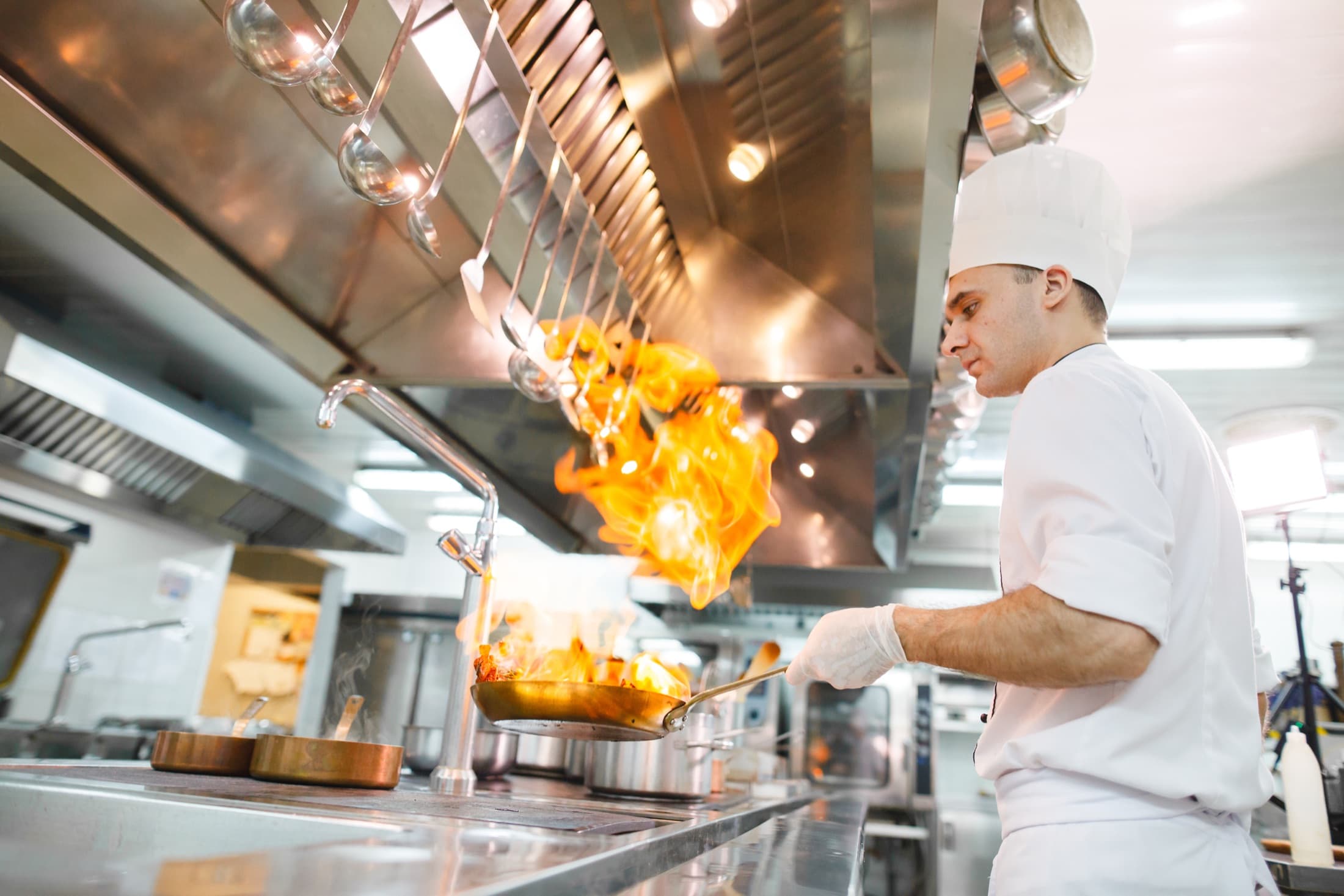 Commercial kitchen with a ventilation hood system